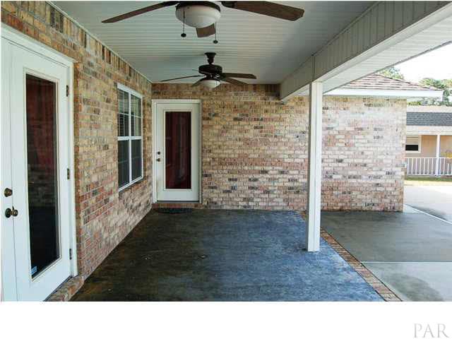 5305 Arrowhead Road Pensacola, FL 32507 - Photo 23 of 24 covered lanai with entries to both the master & the living room