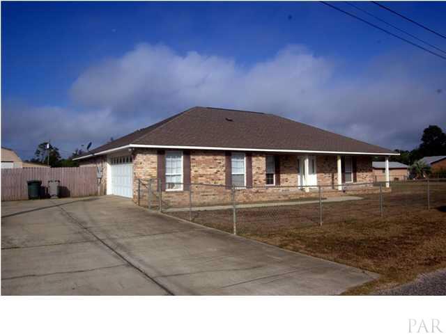 5305 Arrowhead Road Pensacola, FL 32507 - Photo 3 of 24 side view showing double car side entry garage & oversized driveway