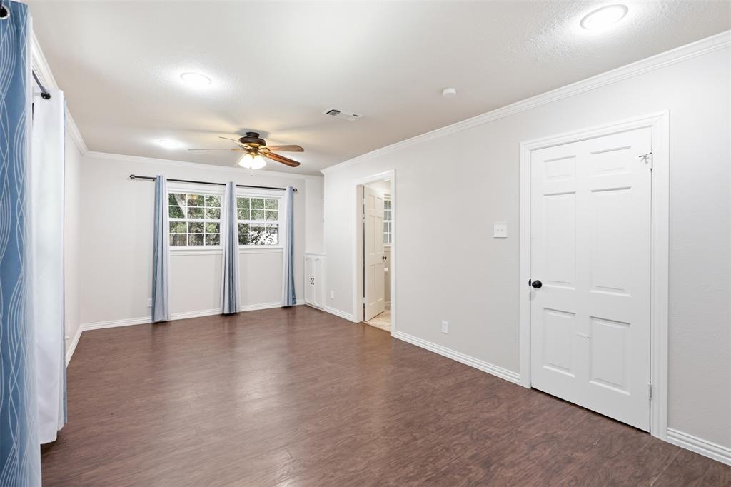 103 Paint Brush Road Lakeside, TX 76108 - Photo 13 of 24 an empty room with wooden floor and windows