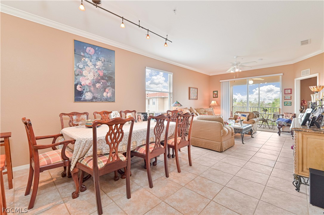 8251 Pathfinder Loop, Unit 641 Fort Myers, FL 33919 - Photo 12 of 37 a living room with furniture and a large window
