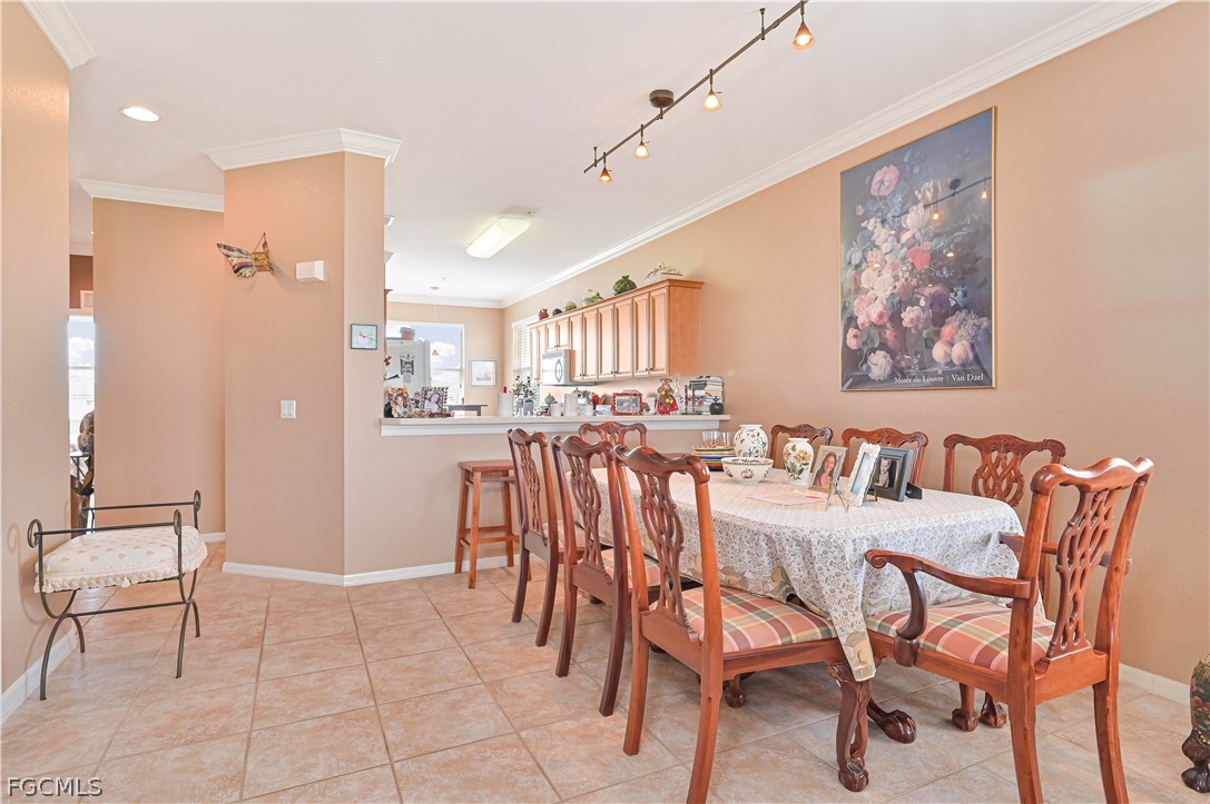 8251 Pathfinder Loop, Unit 641 Fort Myers, FL 33919 - Photo 13 of 37 a view of a dining room with furniture