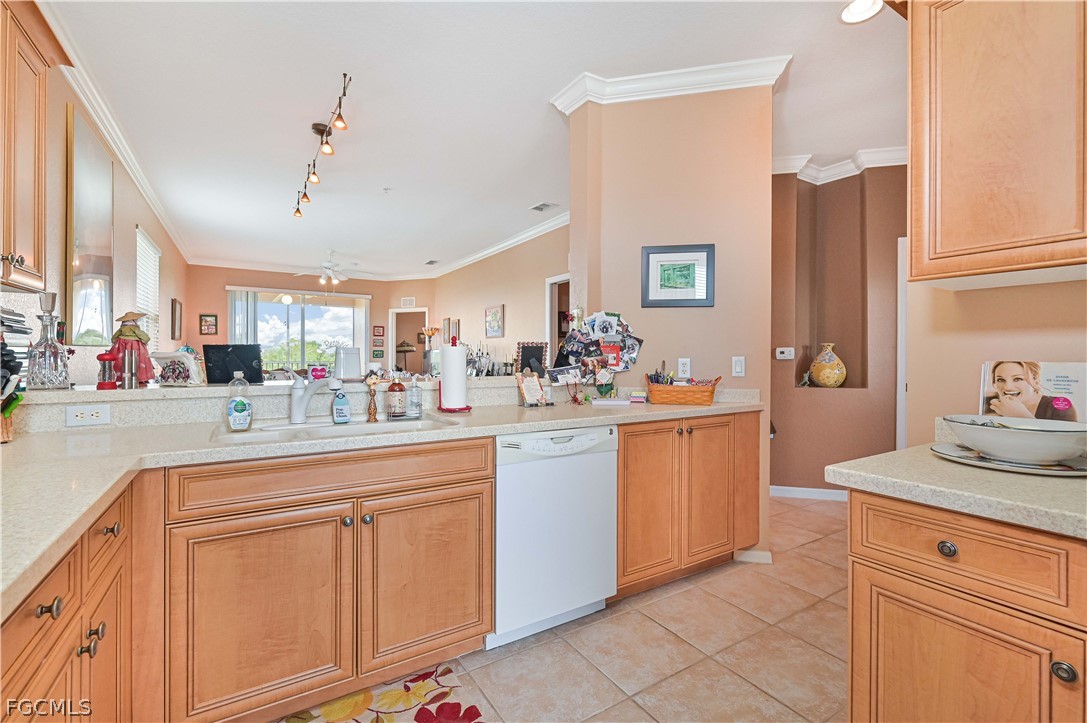 8251 Pathfinder Loop, Unit 641 Fort Myers, FL 33919 - Photo 17 of 37 a kitchen with stainless steel appliances granite countertop a sink and cabinets