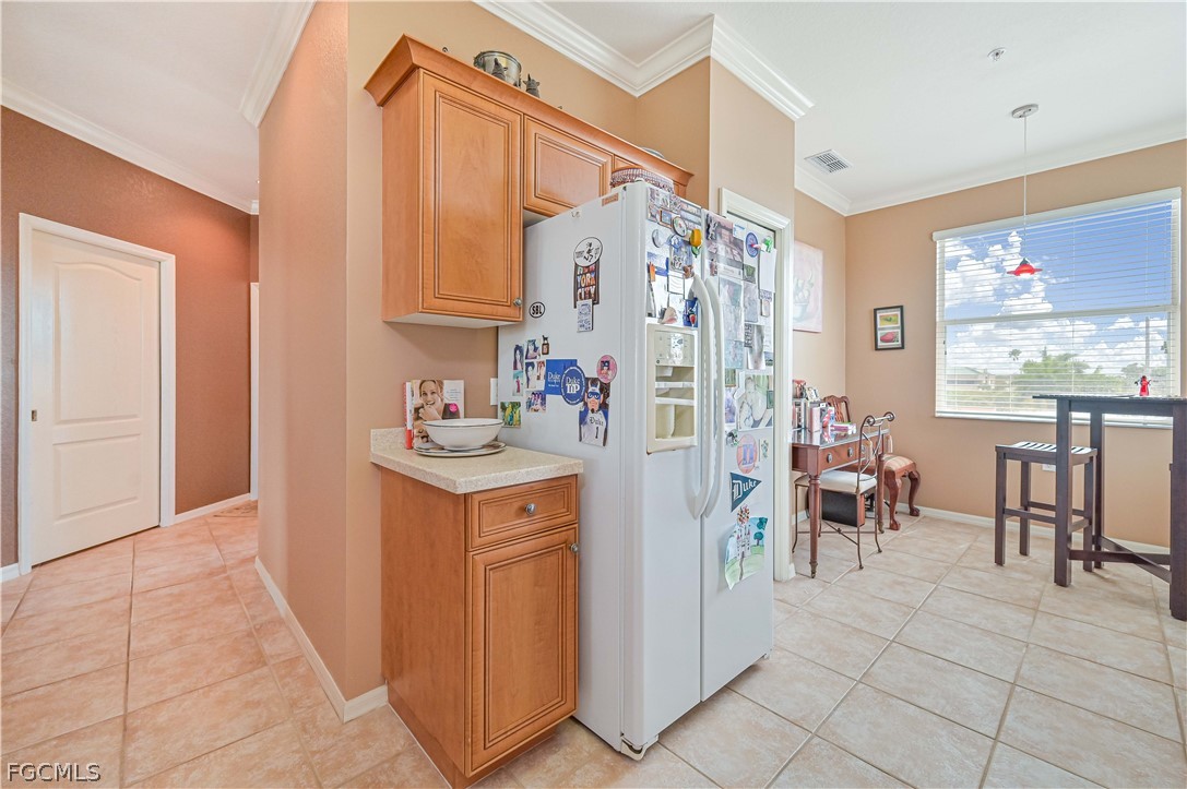 8251 Pathfinder Loop, Unit 641 Fort Myers, FL 33919 - Photo 19 of 37 a room filled with furniture and a chandelier