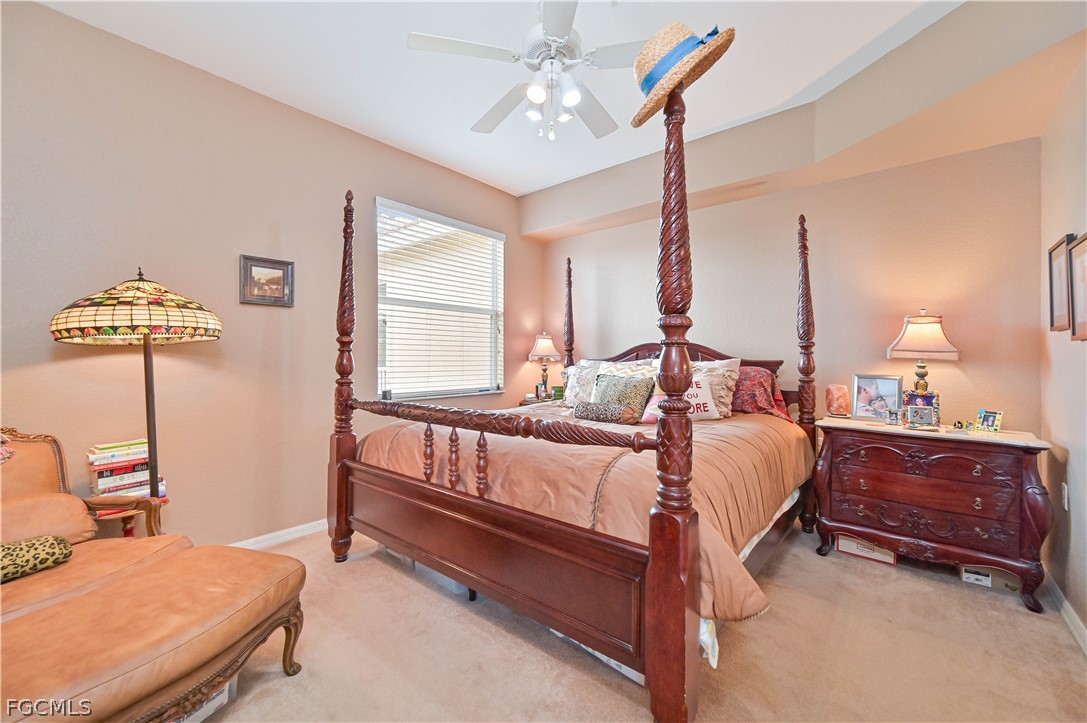 8251 Pathfinder Loop, Unit 641 Fort Myers, FL 33919 - Photo 21 of 37 a bed room with a bed window and a chair