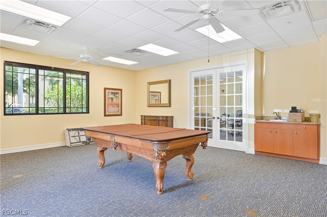 8251 Pathfinder Loop, Unit 641 Fort Myers, FL 33919 - Photo 31 of 37 a room with pool table and windows