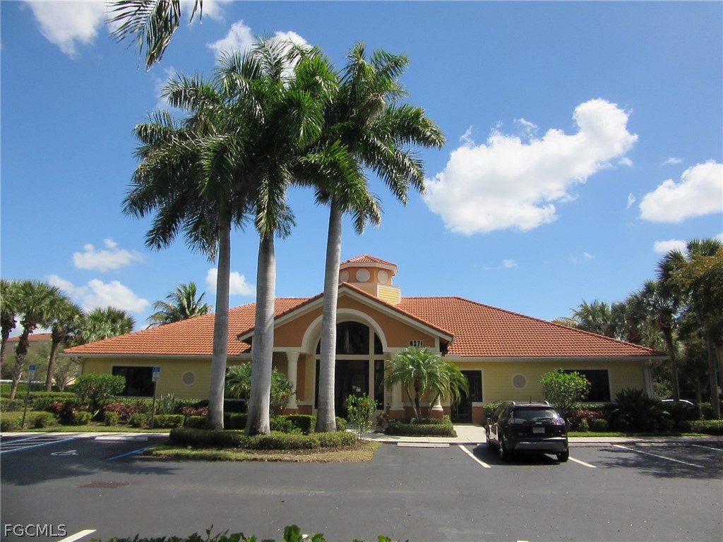 8251 Pathfinder Loop, Unit 641 Fort Myers, FL 33919 - Photo 35 of 37 a car parked in front of a house