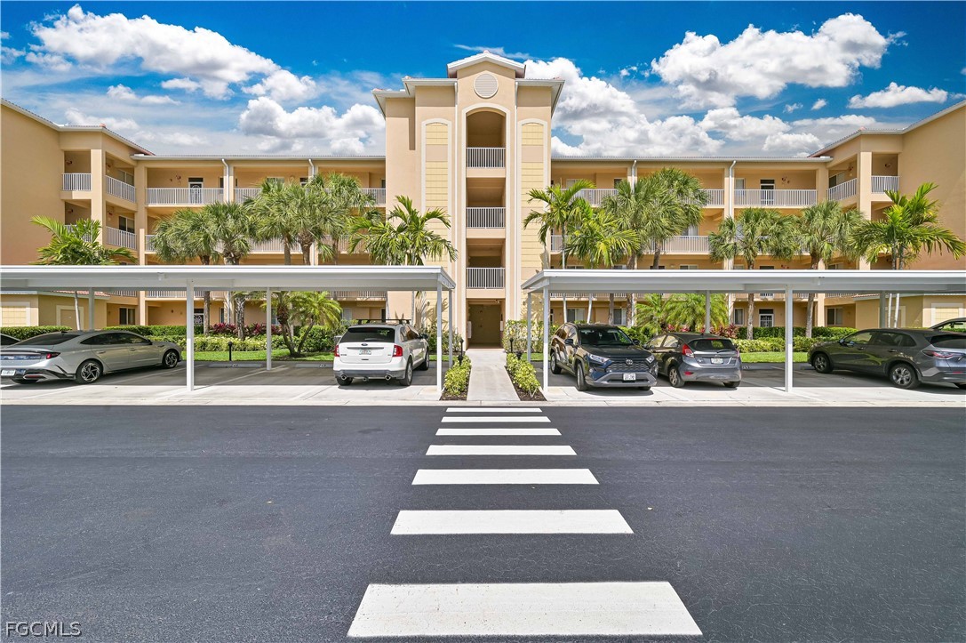 8251 Pathfinder Loop, Unit 641 Fort Myers, FL 33919 - Photo 5 of 37 a front view of a building with street view
