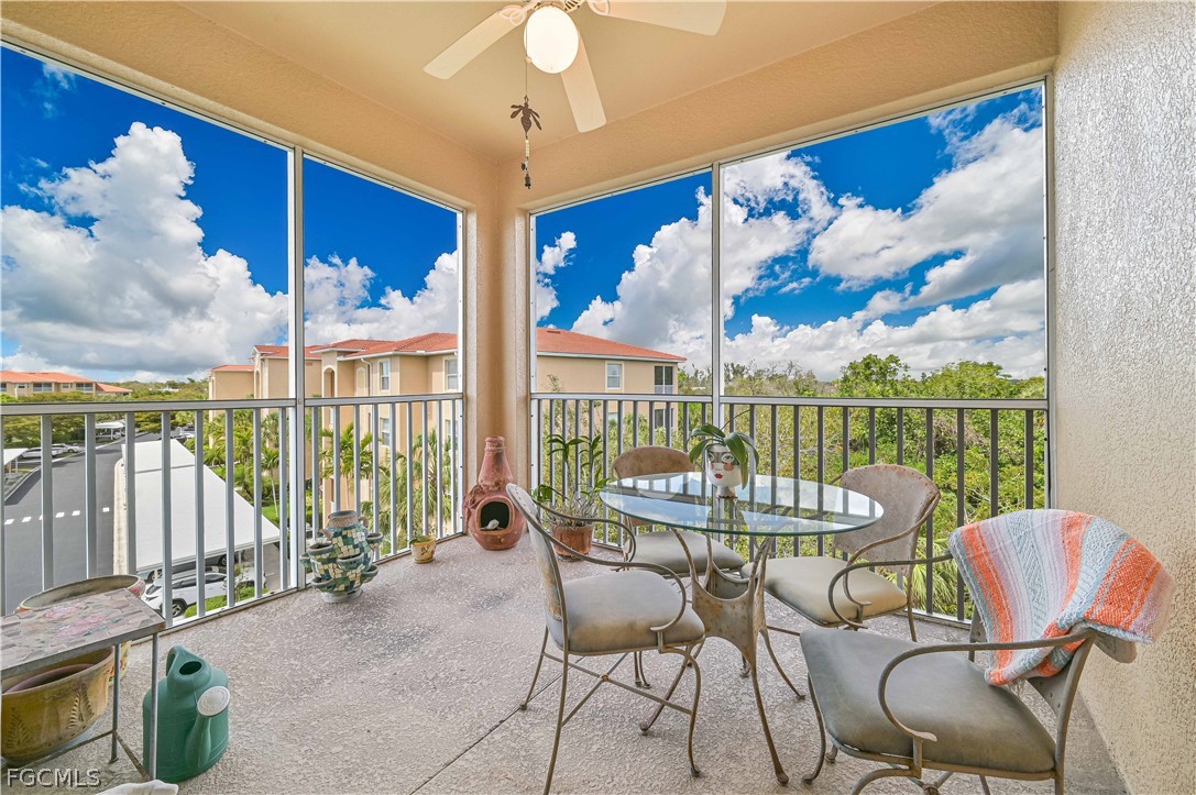 8251 Pathfinder Loop, Unit 641 Fort Myers, FL 33919 - Photo 7 of 37 a view of a chairs and table in patio