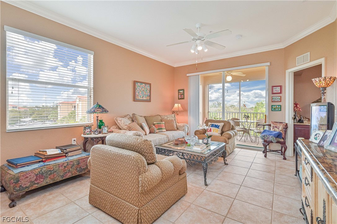 8251 Pathfinder Loop, Unit 641 Fort Myers, FL 33919 - Photo 8 of 37 a living room with furniture and a large window