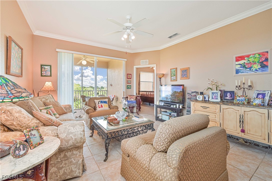 8251 Pathfinder Loop, Unit 641 Fort Myers, FL 33919 - Photo 9 of 37 a living room with furniture and a large window