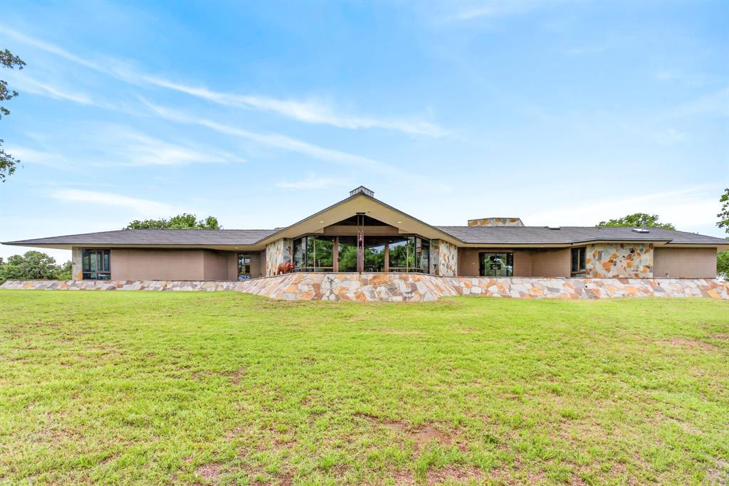 1080 North Greenbrier Road Nocona, TX 76255 - Photo 2 of 40 Expansive single-story residence with a prominent gabled entry