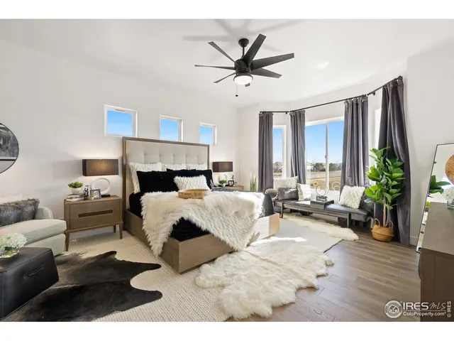 a bed room with a bed window and a couch