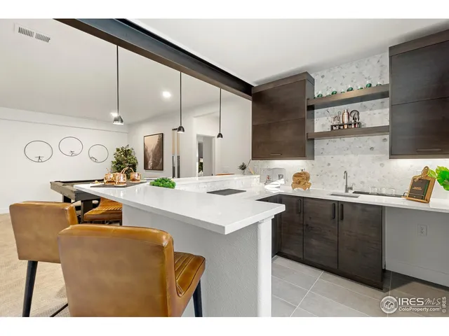 a kitchen with a sink cabinets and window