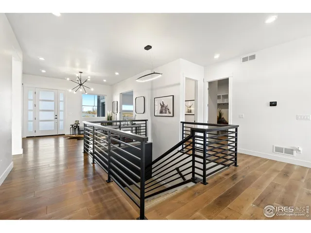 a view of a living room and kitchen area