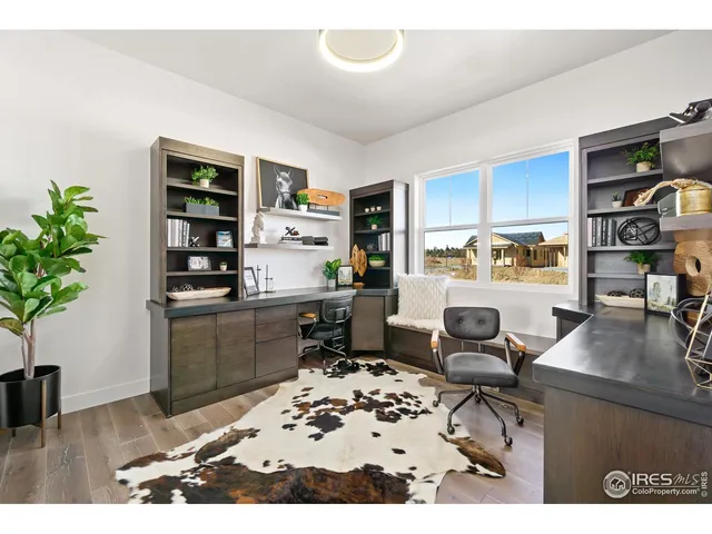 a kitchen with a table and chairs in it