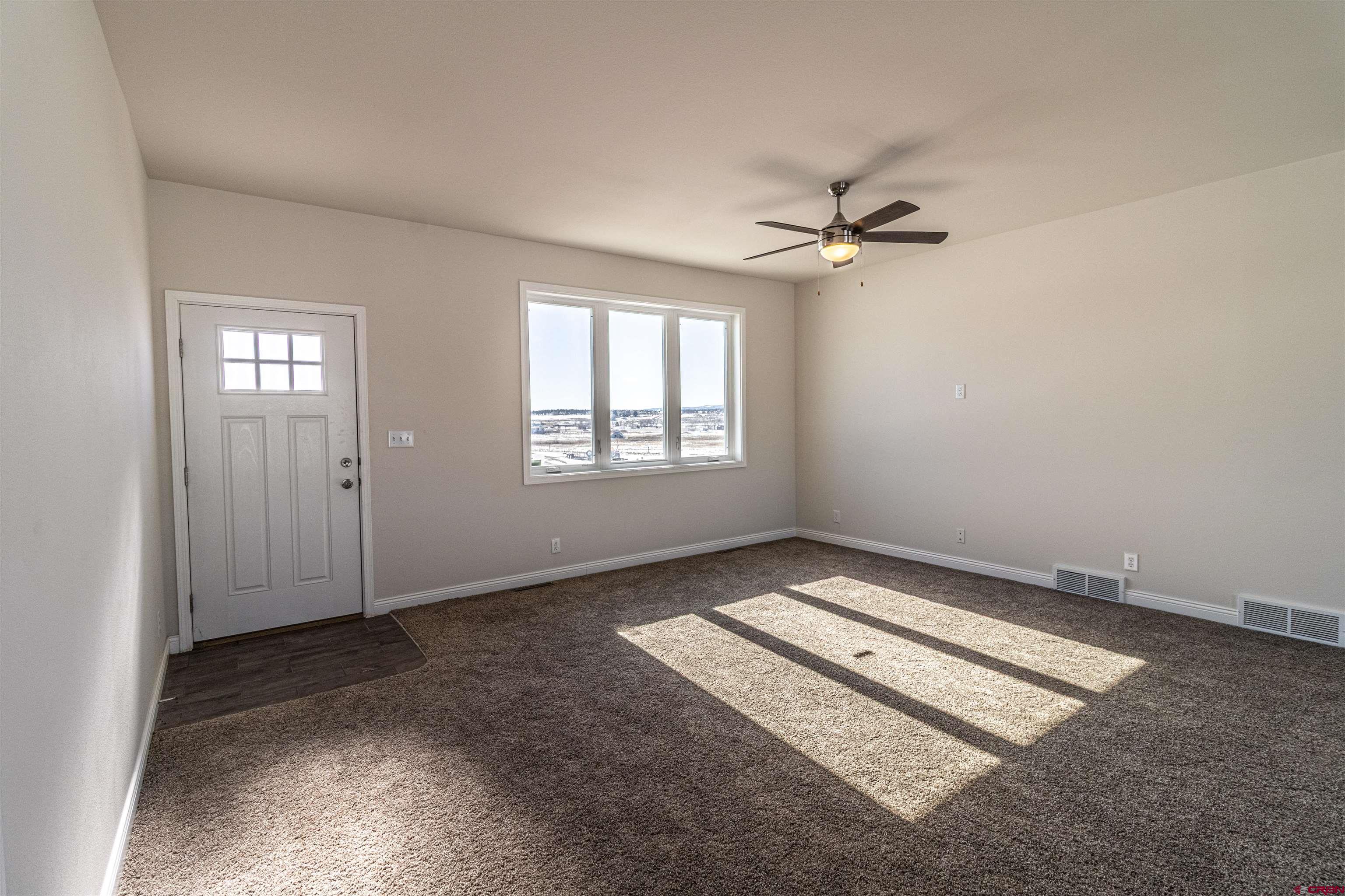 200 Chesterfield Place Ignacio, CO 81137 - Photo 14 of 35 an empty room with windows and fan