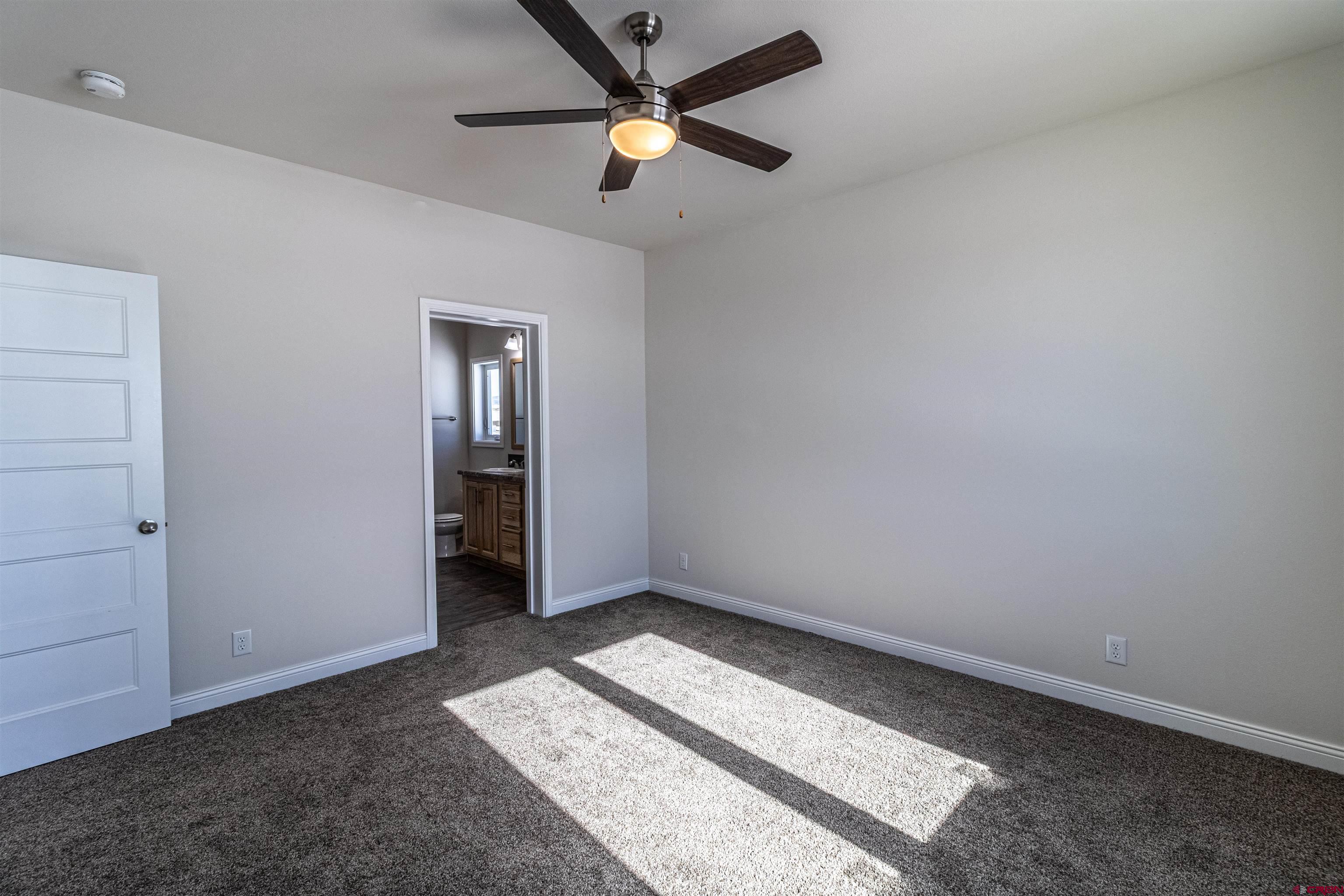 200 Chesterfield Place Ignacio, CO 81137 - Photo 16 of 35 an empty room with fan and a ceiling fan