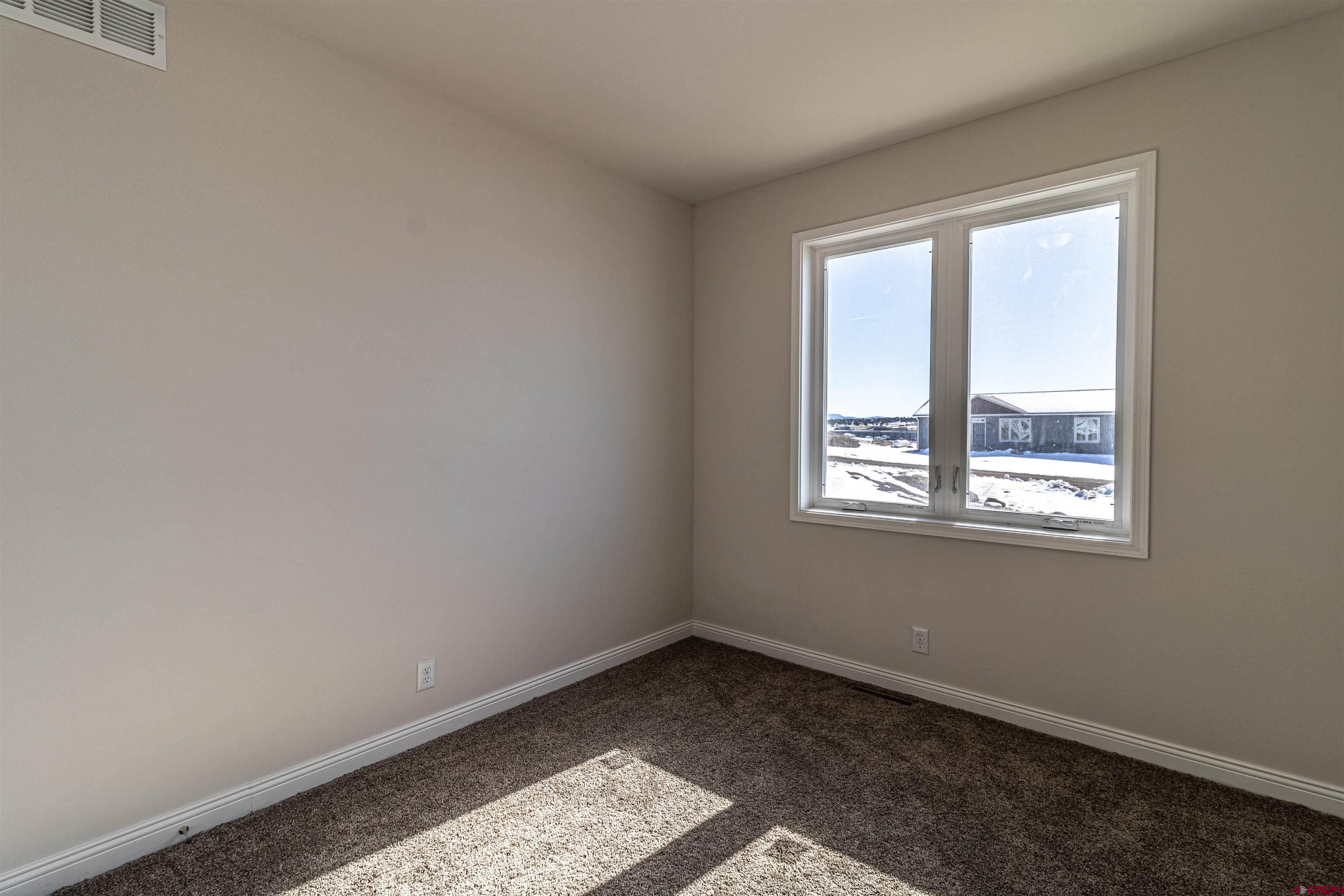 200 Chesterfield Place Ignacio, CO 81137 - Photo 25 of 35 a view of an empty room with a window