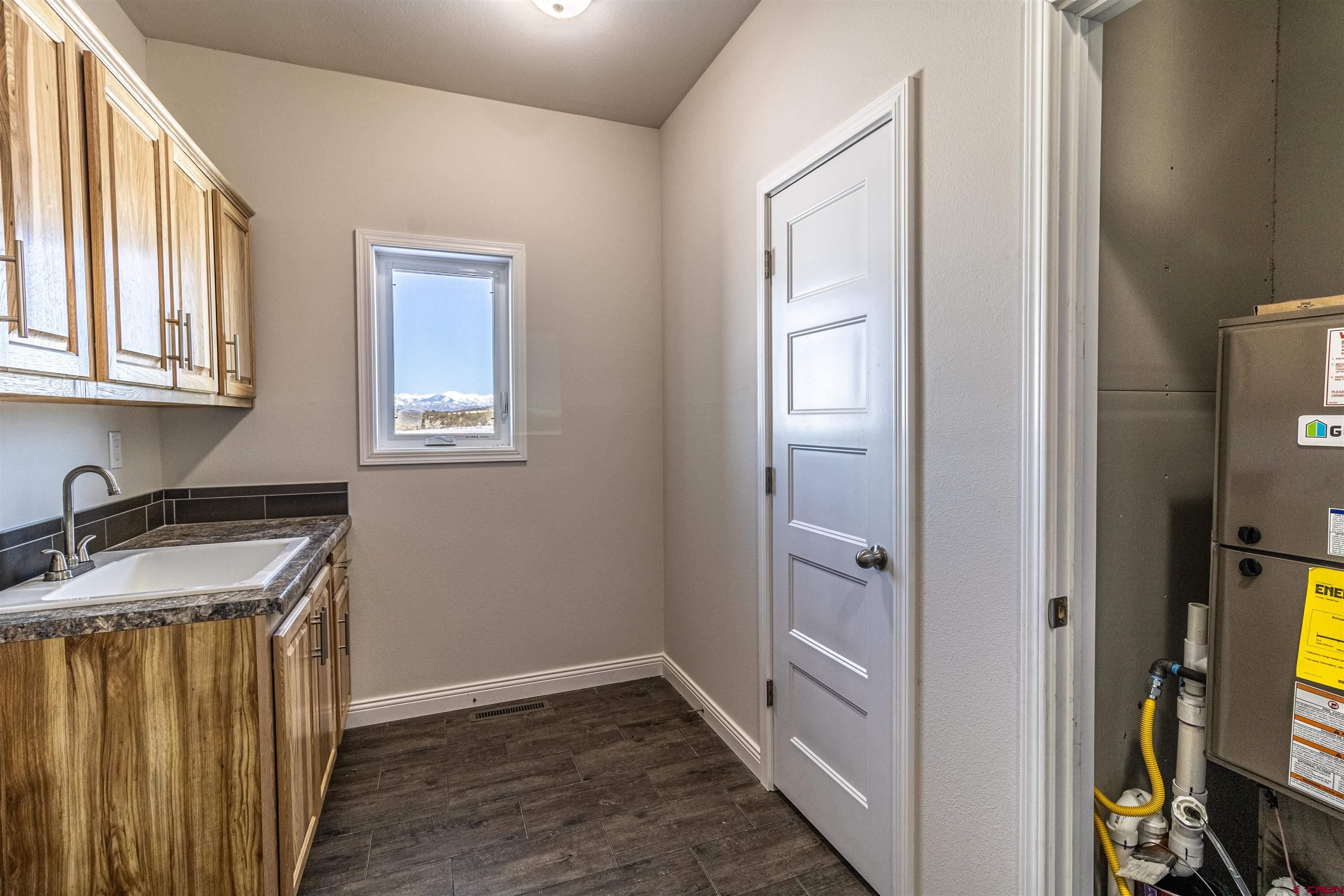 200 Chesterfield Place Ignacio, CO 81137 - Photo 31 of 35 a bathroom with a sink a mirror and a shower