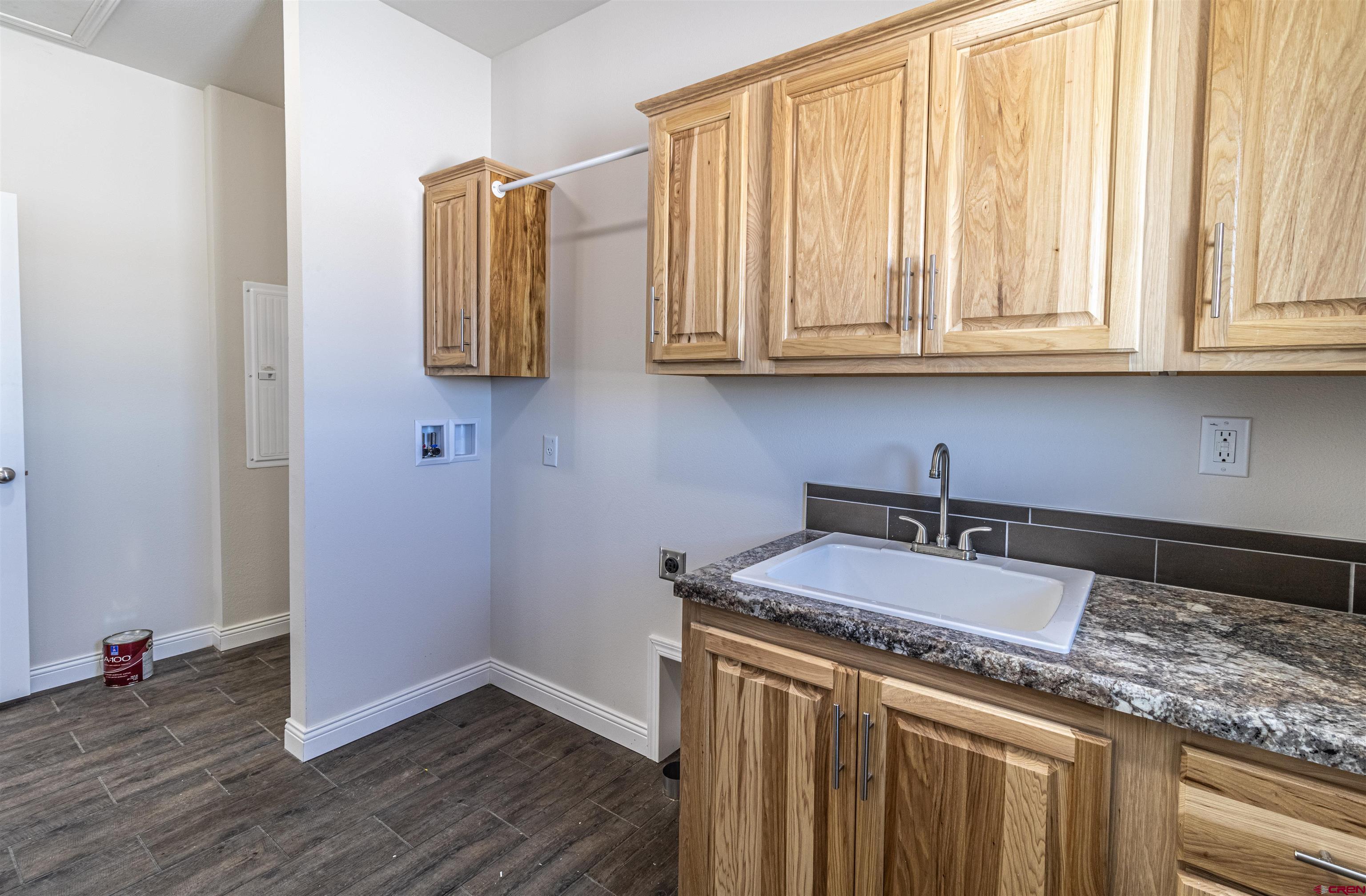 200 Chesterfield Place Ignacio, CO 81137 - Photo 32 of 35 an empty room with wooden floor and cabinet