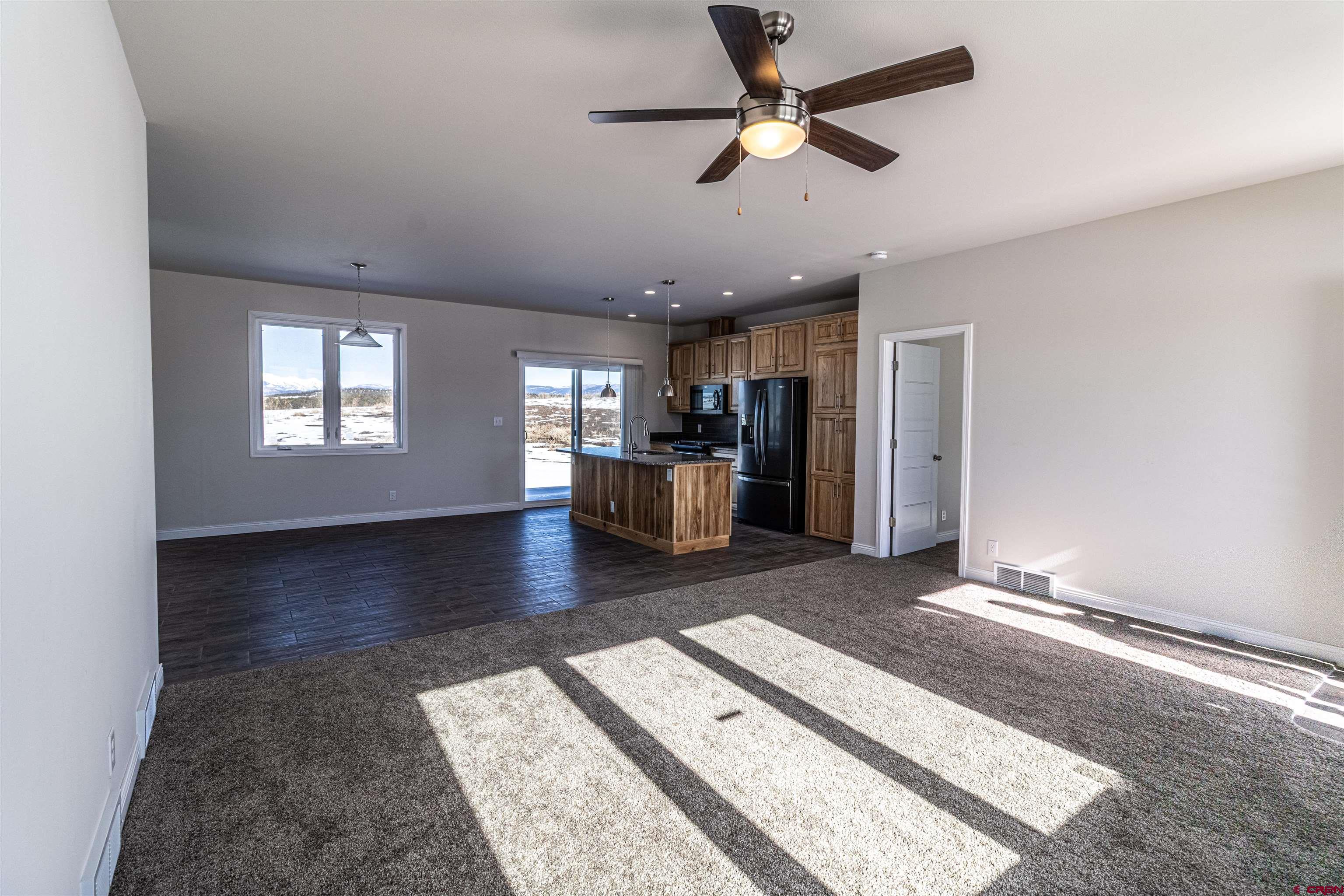 200 Chesterfield Place Ignacio, CO 81137 - Photo 6 of 35 a view of a living room a window and a ceiling fan