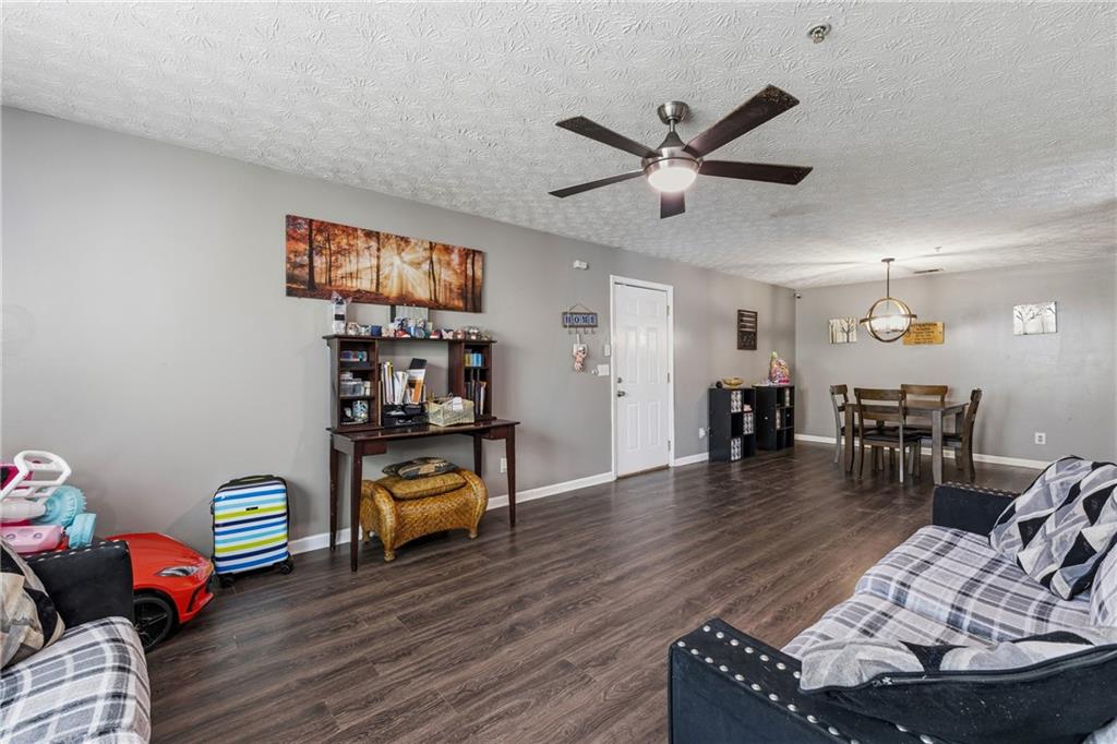 6203 Fairington Ridge Circle Stonecrest, GA 30038 - Photo 3 of 13 a living room with furniture and wooden floor