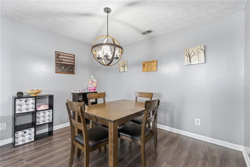 6203 Fairington Ridge Circle Stonecrest, GA 30038 - Photo 4 of 13 a view of a dining room with a table and chairs