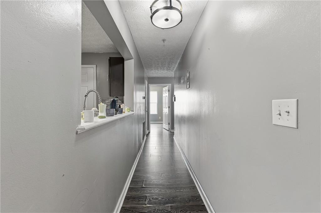 6203 Fairington Ridge Circle Stonecrest, GA 30038 - Photo 7 of 13 a view of a hallway with wooden floor