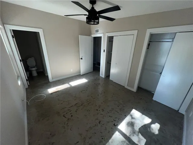 a view of a hallway with a chandelier
