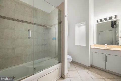 a bathroom with a shower and a sink