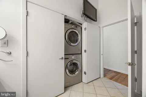 a utility room with sink dryer and washer
