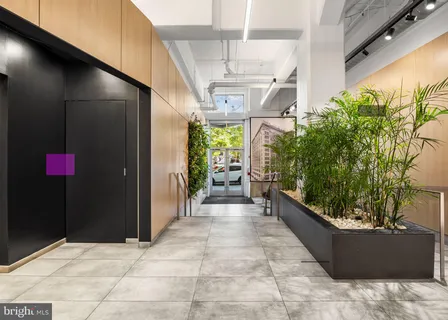 a view of a patio with table and chairs and potted plants
