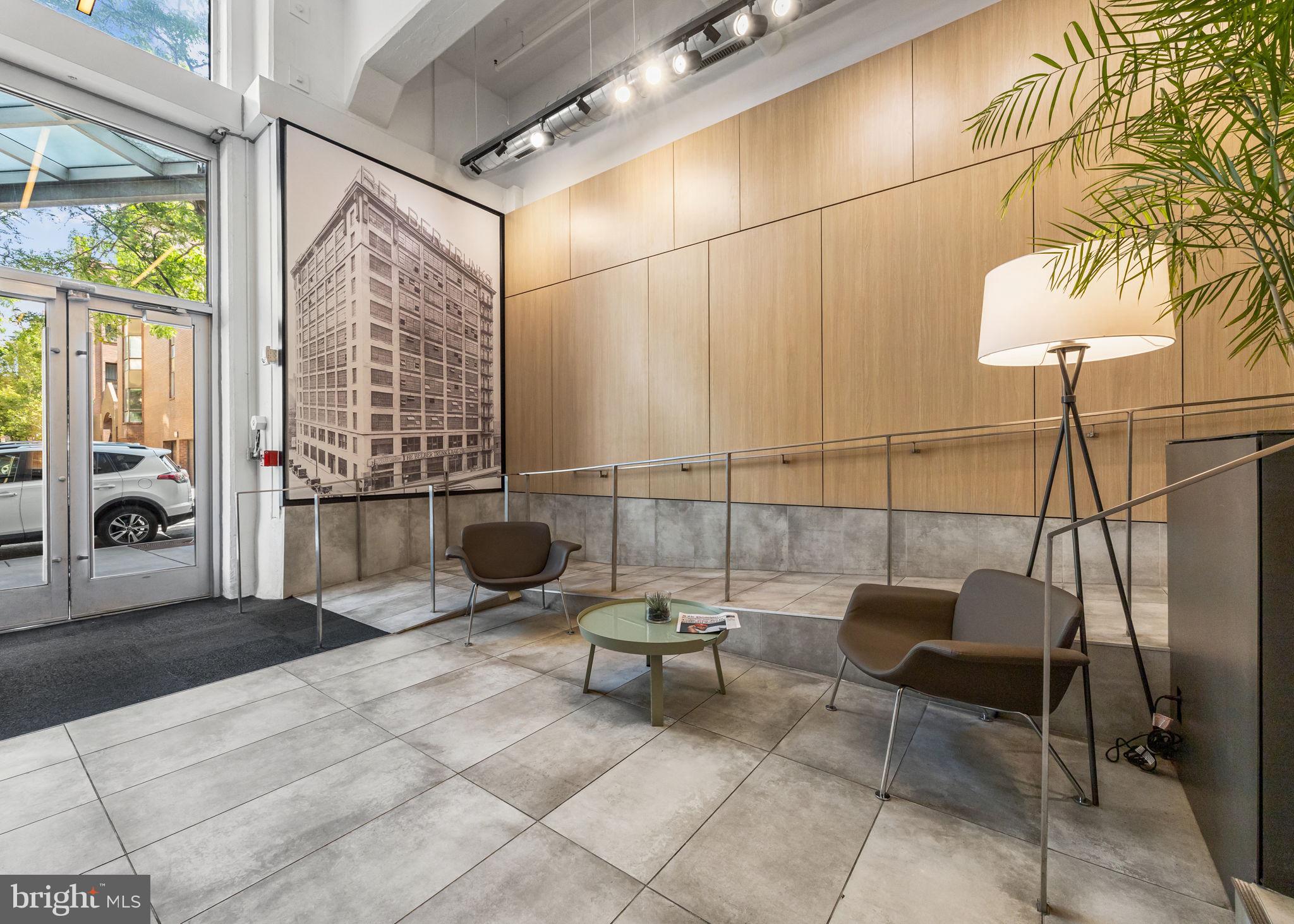 2200-28 Arch Street, Unit 716 Philadelphia, PA 19103 - Photo 24 of 35 a view of a patio with table and chairs and potted plants
