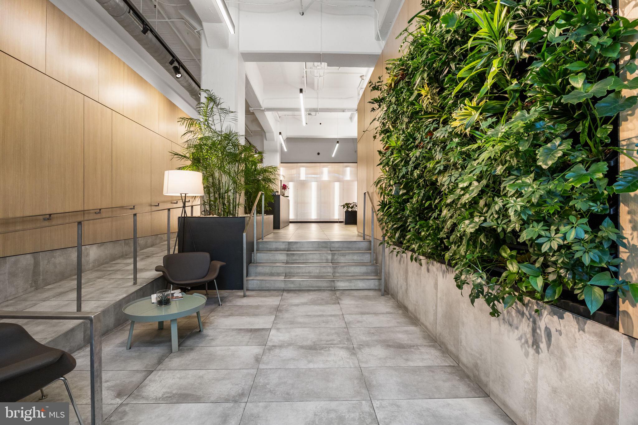 2200-28 Arch Street, Unit 716 Philadelphia, PA 19103 - Photo 25 of 35 a view of a porch with chairs and potted plants