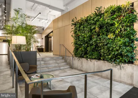 a view of hallway with wooden floor