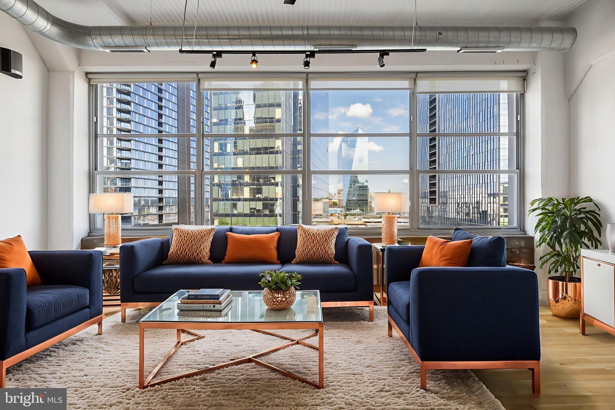 2200-28 Arch Street, Unit 716 Philadelphia, PA 19103 - Photo 9 of 35 a outdoor living space with furniture and a potted plant