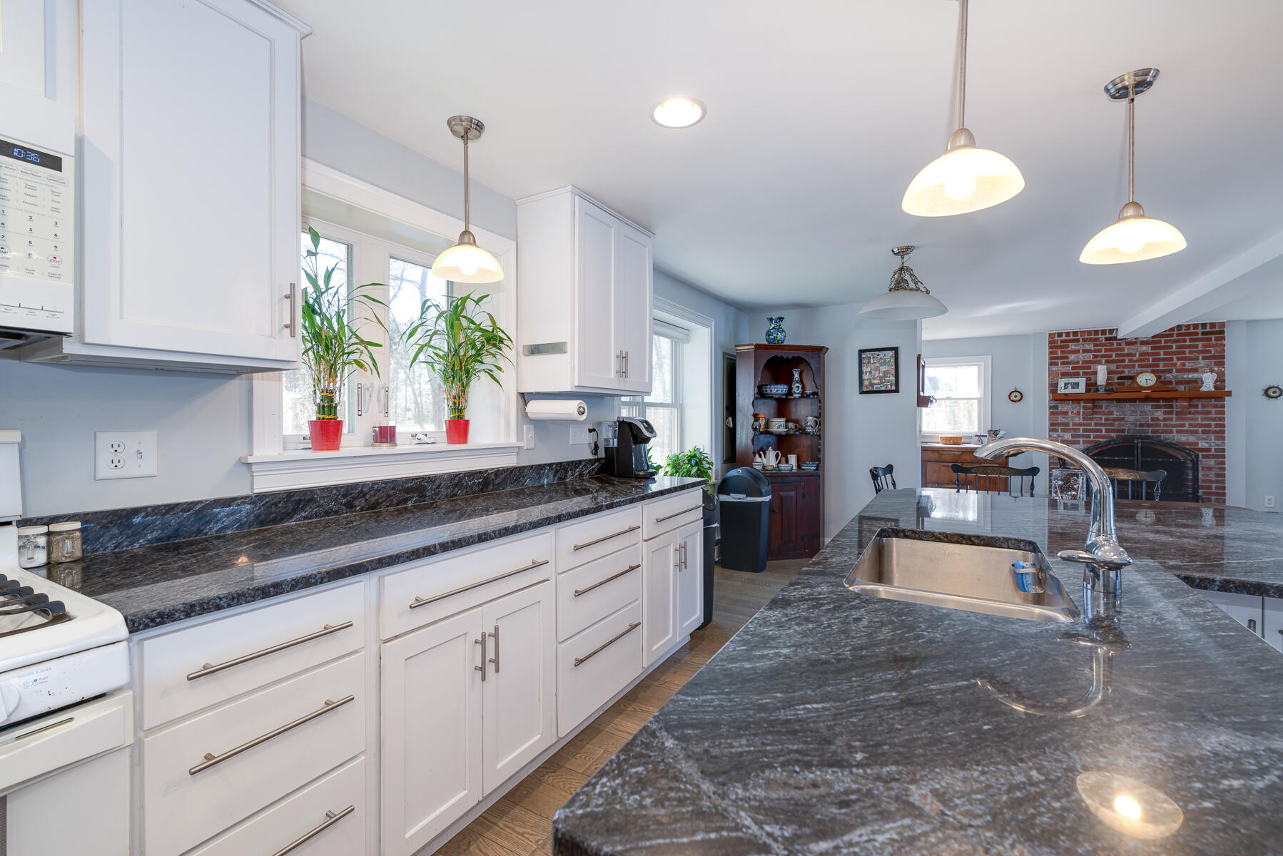 65 Santuit Lane Mashpee, MA 02649 - Photo 13 of 52 a kitchen with counter top space a sink and stainless steel appliances