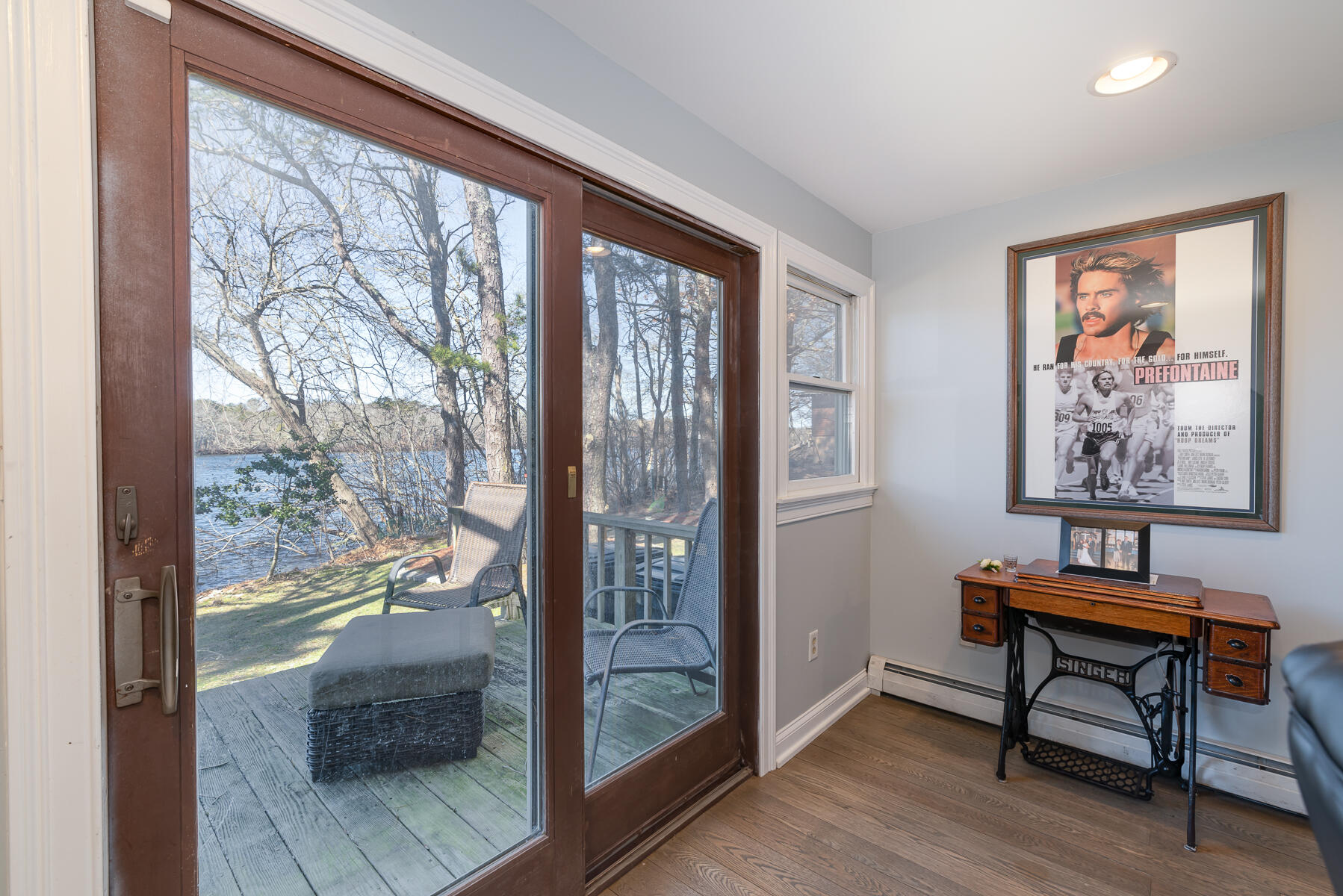 65 Santuit Lane Mashpee, MA 02649 - Photo 17 of 52 a workspace with wooden floor and a large window