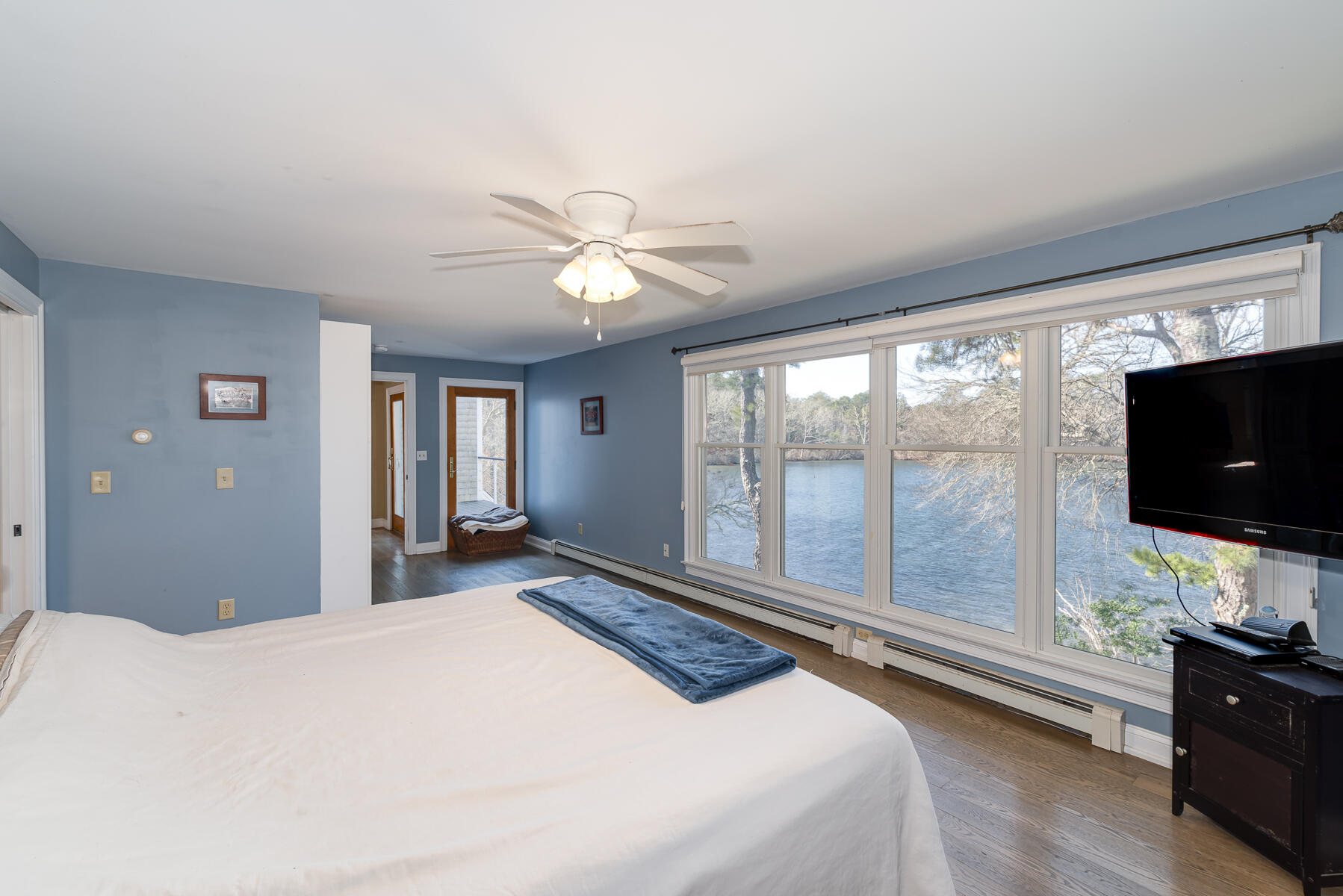 65 Santuit Lane Mashpee, MA 02649 - Photo 26 of 52 a bedroom with a bed and a flat screen tv