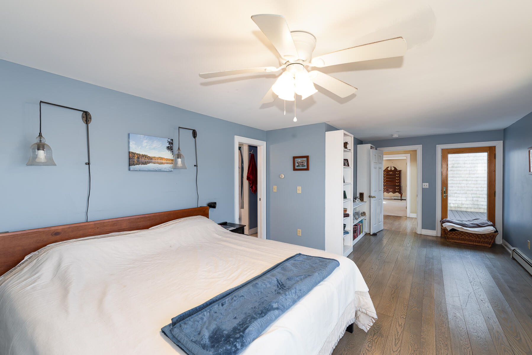 65 Santuit Lane Mashpee, MA 02649 - Photo 29 of 52 a bedroom with a large bed and a chandelier