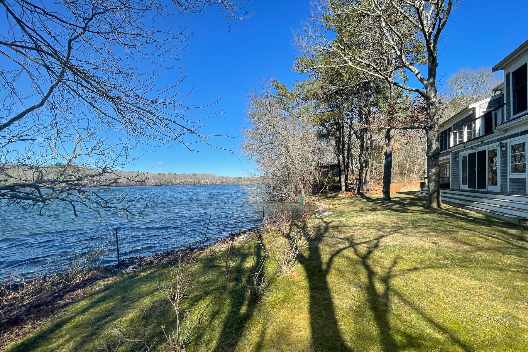 65 Santuit Lane Mashpee, MA 02649 - Photo 3 of 52 a view of a backyard with wooden fence