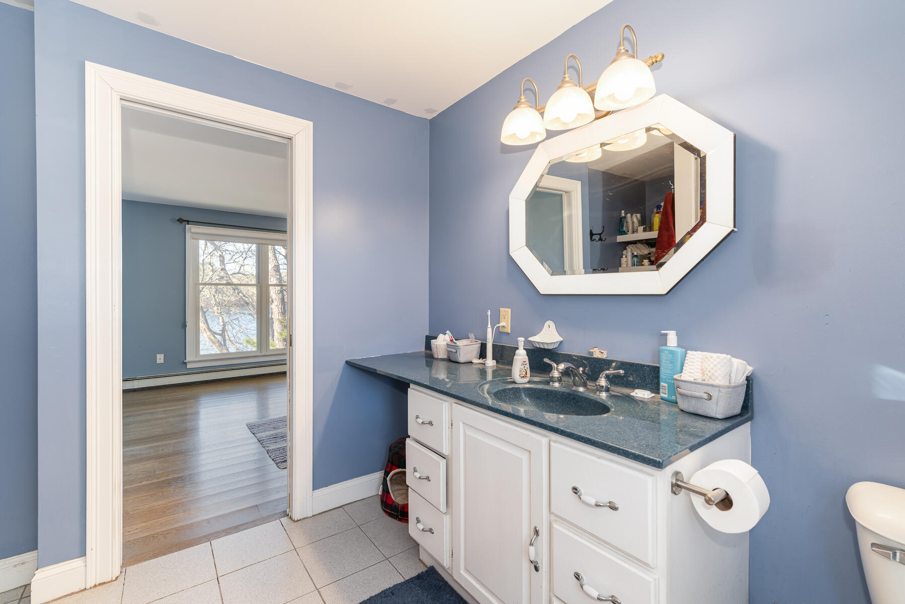 65 Santuit Lane Mashpee, MA 02649 - Photo 32 of 52 a bathroom with a sink and a mirror