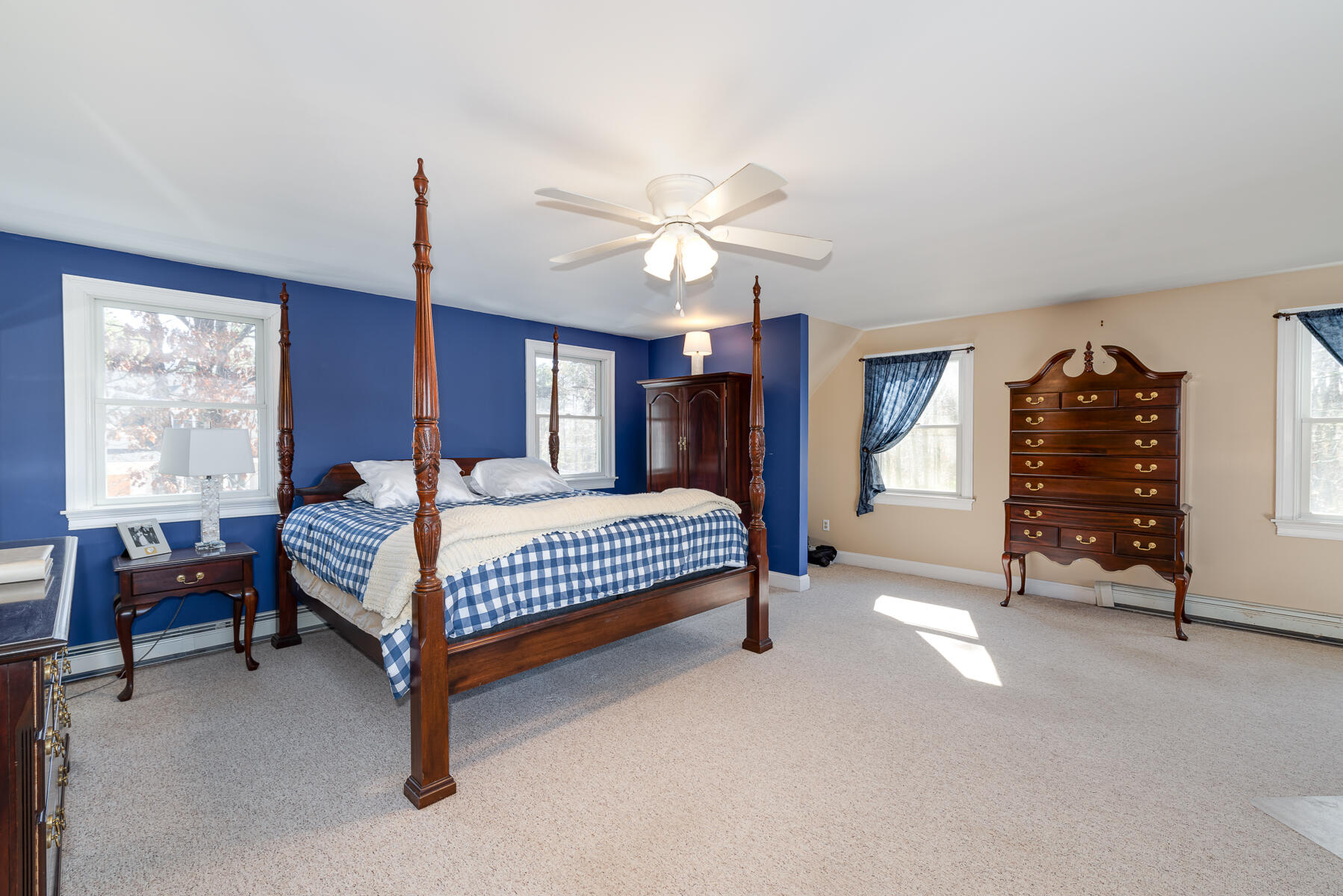 65 Santuit Lane Mashpee, MA 02649 - Photo 33 of 52 a bedroom with a bed and a chandelier