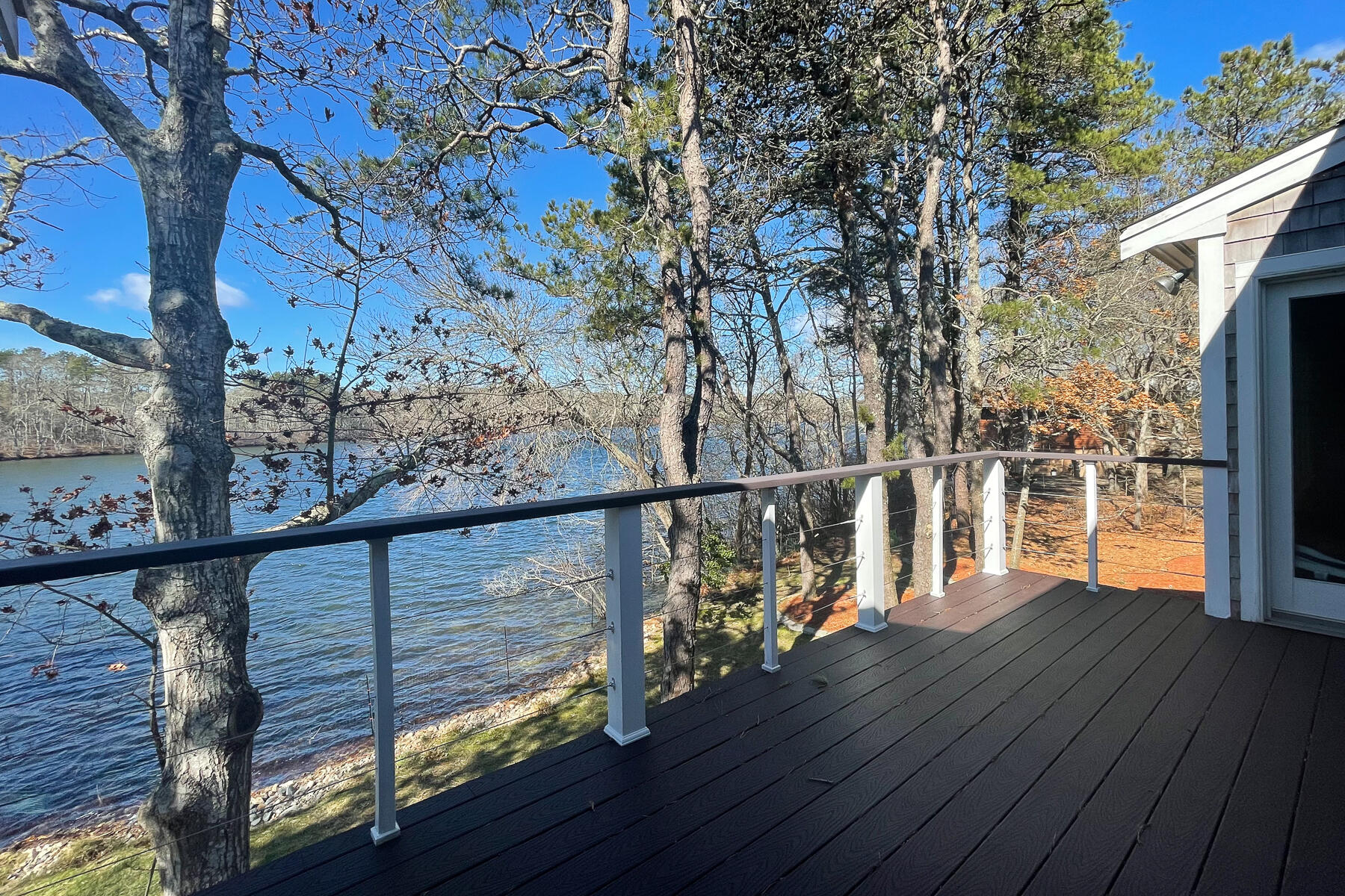 65 Santuit Lane Mashpee, MA 02649 - Photo 39 of 52 a view of a balcony with wooden floor and outdoor space