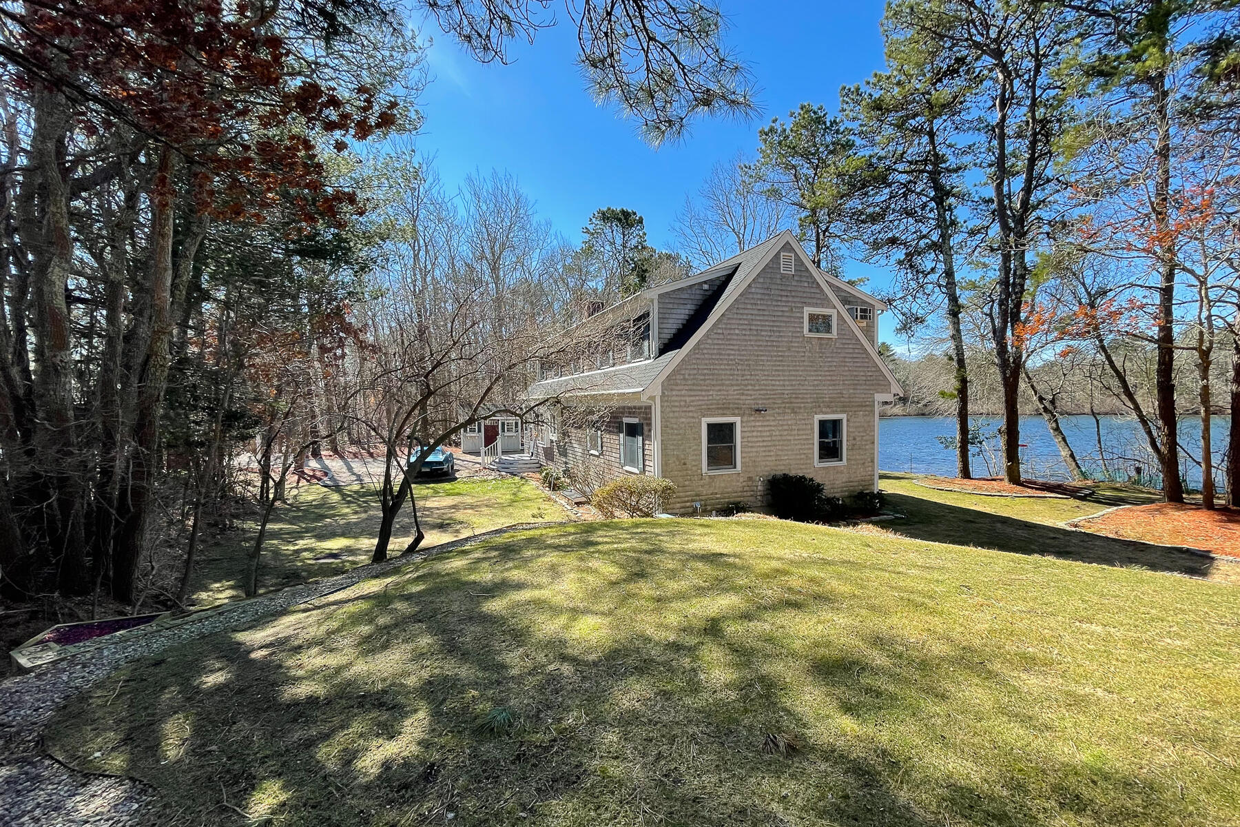 65 Santuit Lane Mashpee, MA 02649 - Photo 4 of 52 a view of a house with a yard
