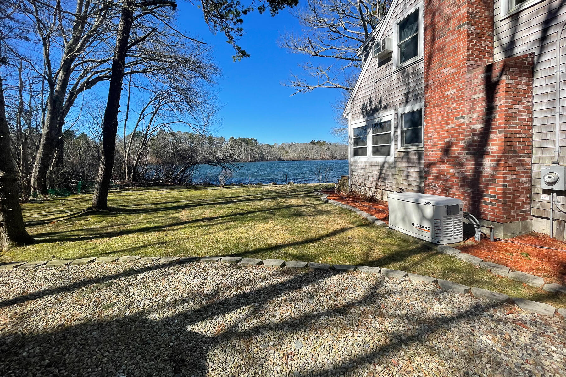 65 Santuit Lane Mashpee, MA 02649 - Photo 47 of 52 a view of a yard with a house
