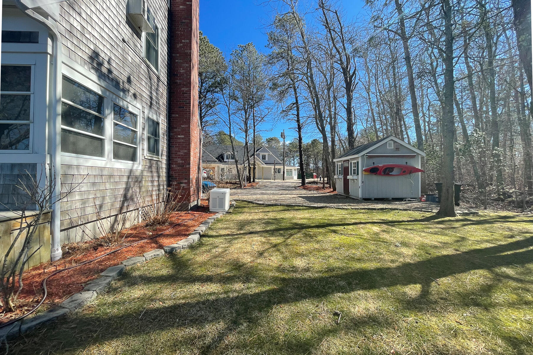 65 Santuit Lane Mashpee, MA 02649 - Photo 49 of 52 a swimming pool with outdoor seating and yard