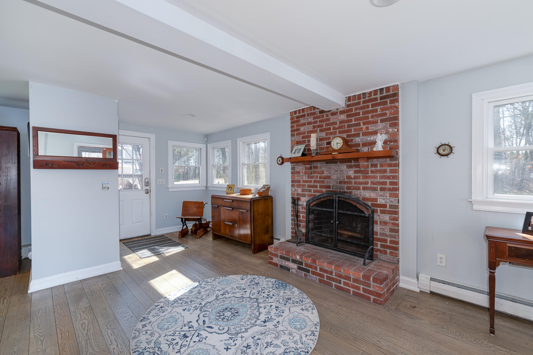 65 Santuit Lane Mashpee, MA 02649 - Photo 6 of 52 a living room with furniture and a fireplace