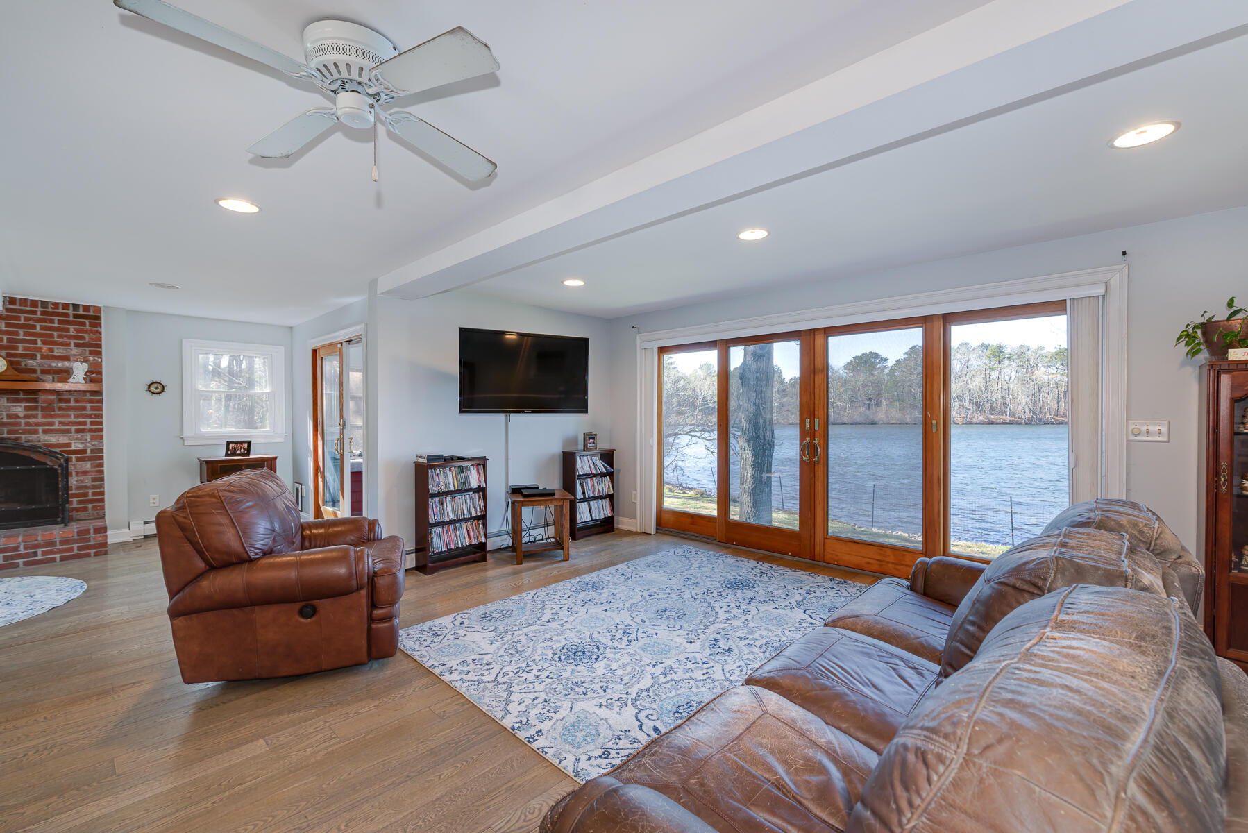 65 Santuit Lane Mashpee, MA 02649 - Photo 7 of 52 a living room with furniture and a flat screen tv