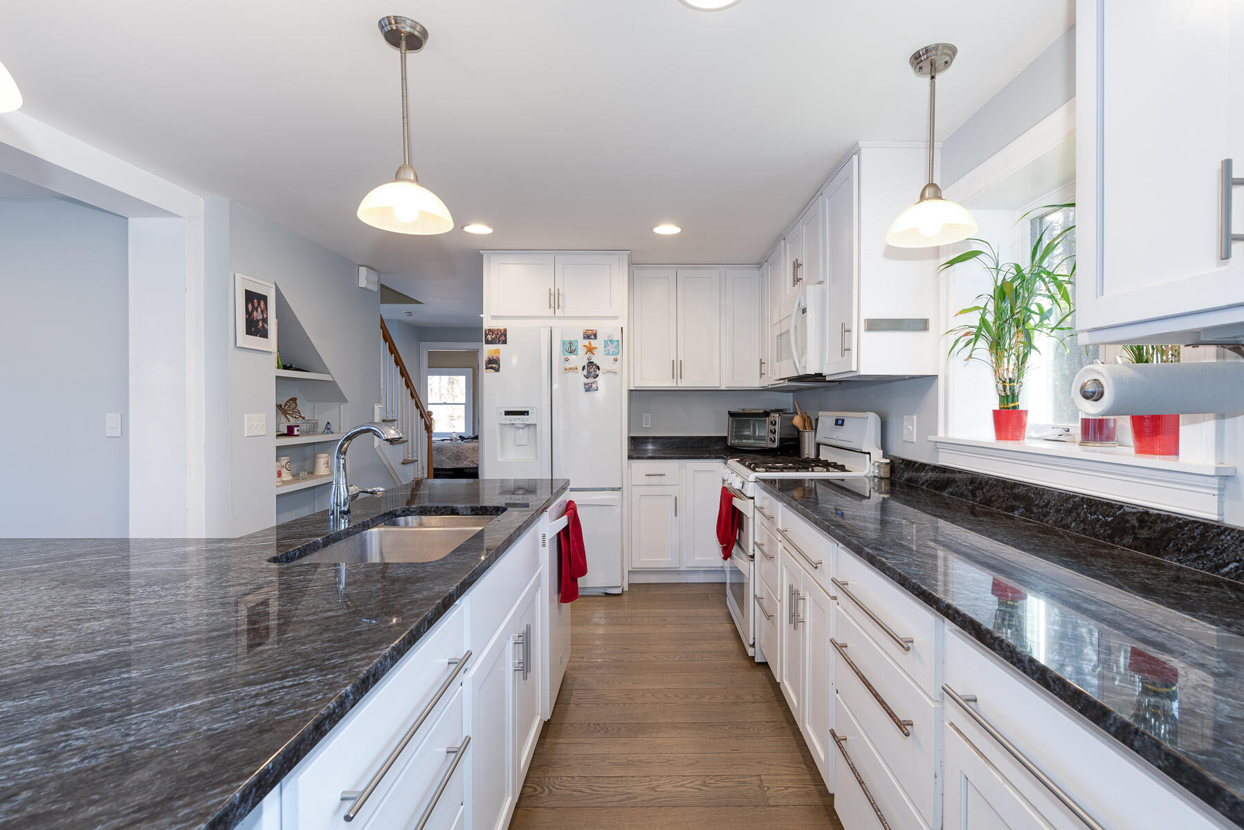 65 Santuit Lane Mashpee, MA 02649 - Photo 8 of 52 a large kitchen with kitchen island granite countertop a sink and a stove